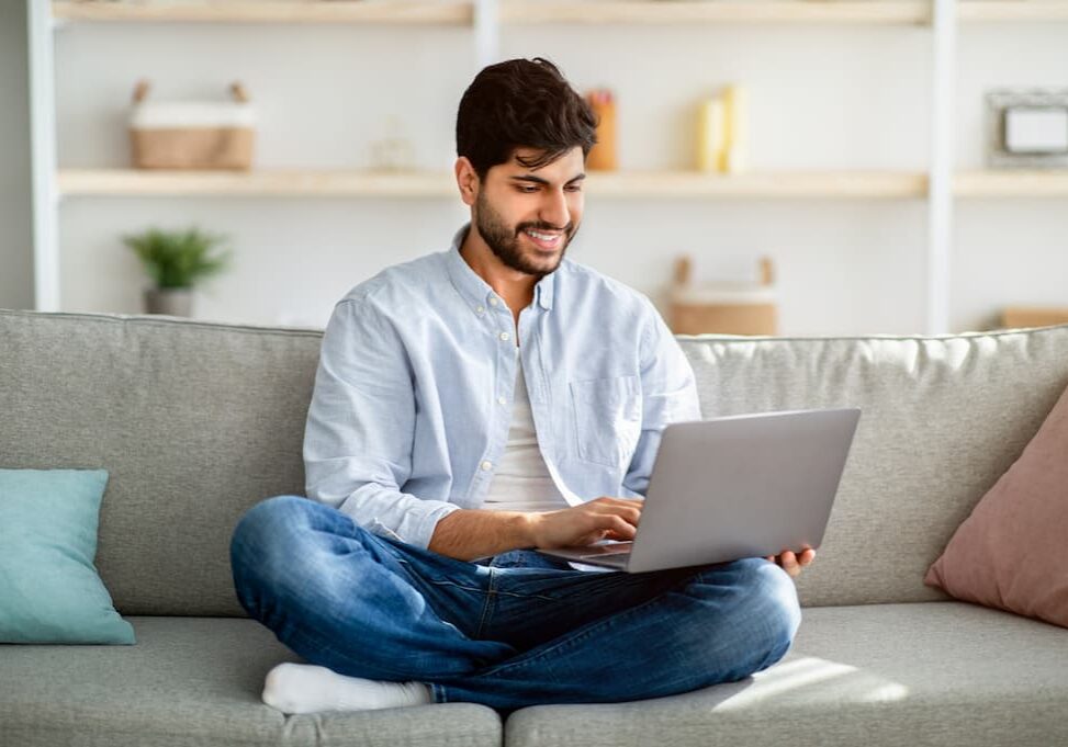 Man using wireless internet computer