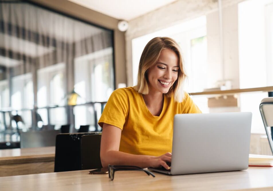 Woman on computer smiling